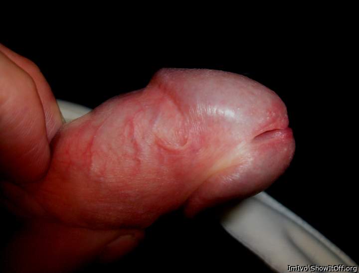 Nude glans with frenulum (extreme closeup)