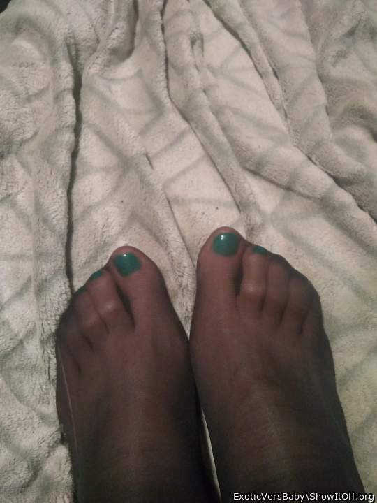 Green painted toes in knee high pantyhose