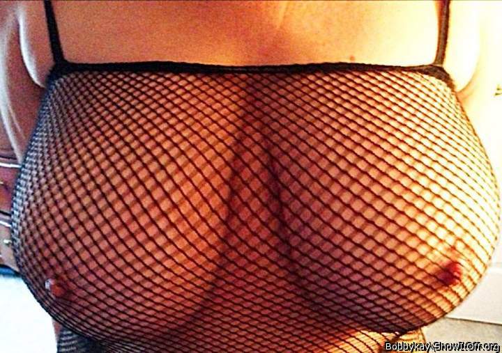 Close up of Kay's fishnet top