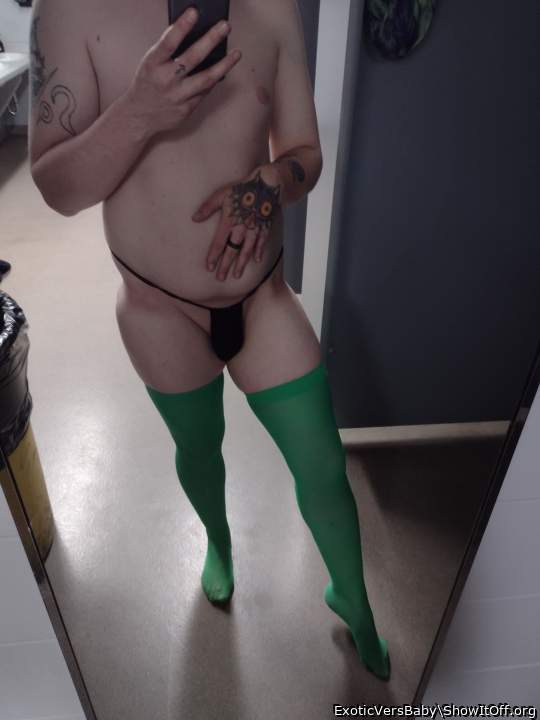 Posing in green nylon thigh highs and black thong at a old job