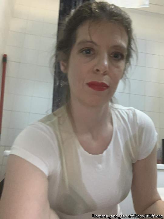 Wet hair , face , top and bra after receiving a golden shower