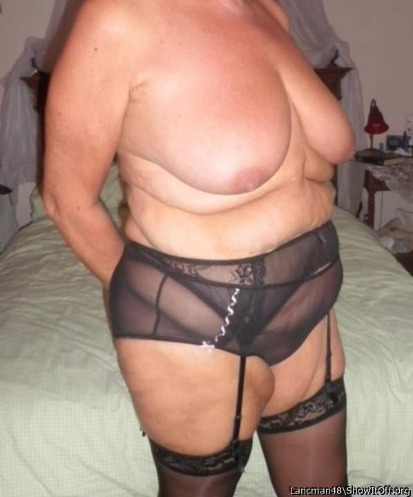 She looks hot in stockings and lingerie like that 